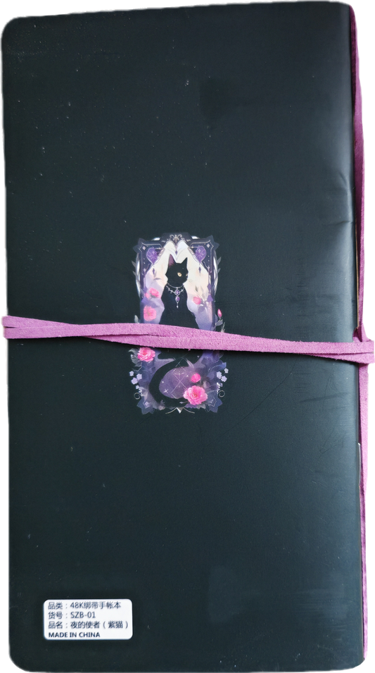 notitieboek met zwarte kat